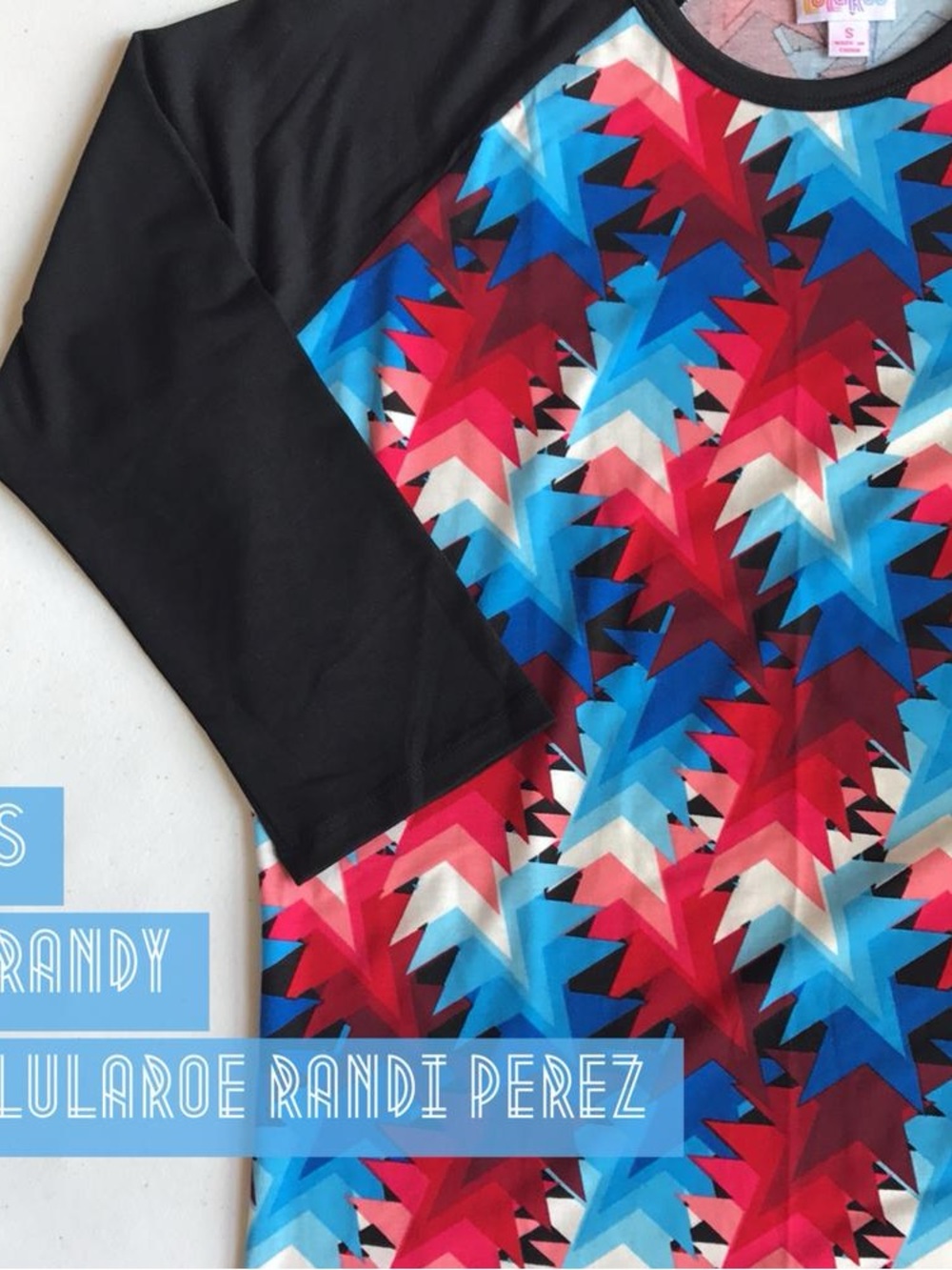 LuLaRoe Randy Tee in Black with Red, Blue & White Starburst Print